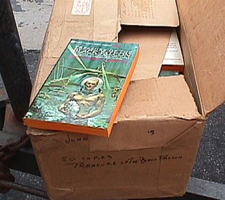 Box of complimentary Ballantine paperbacks: JCB's Treasure of the Black Falcon